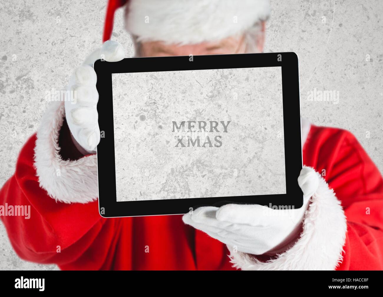 Hands of santa claus holding a digital tablet Stock Photo - Alamy
