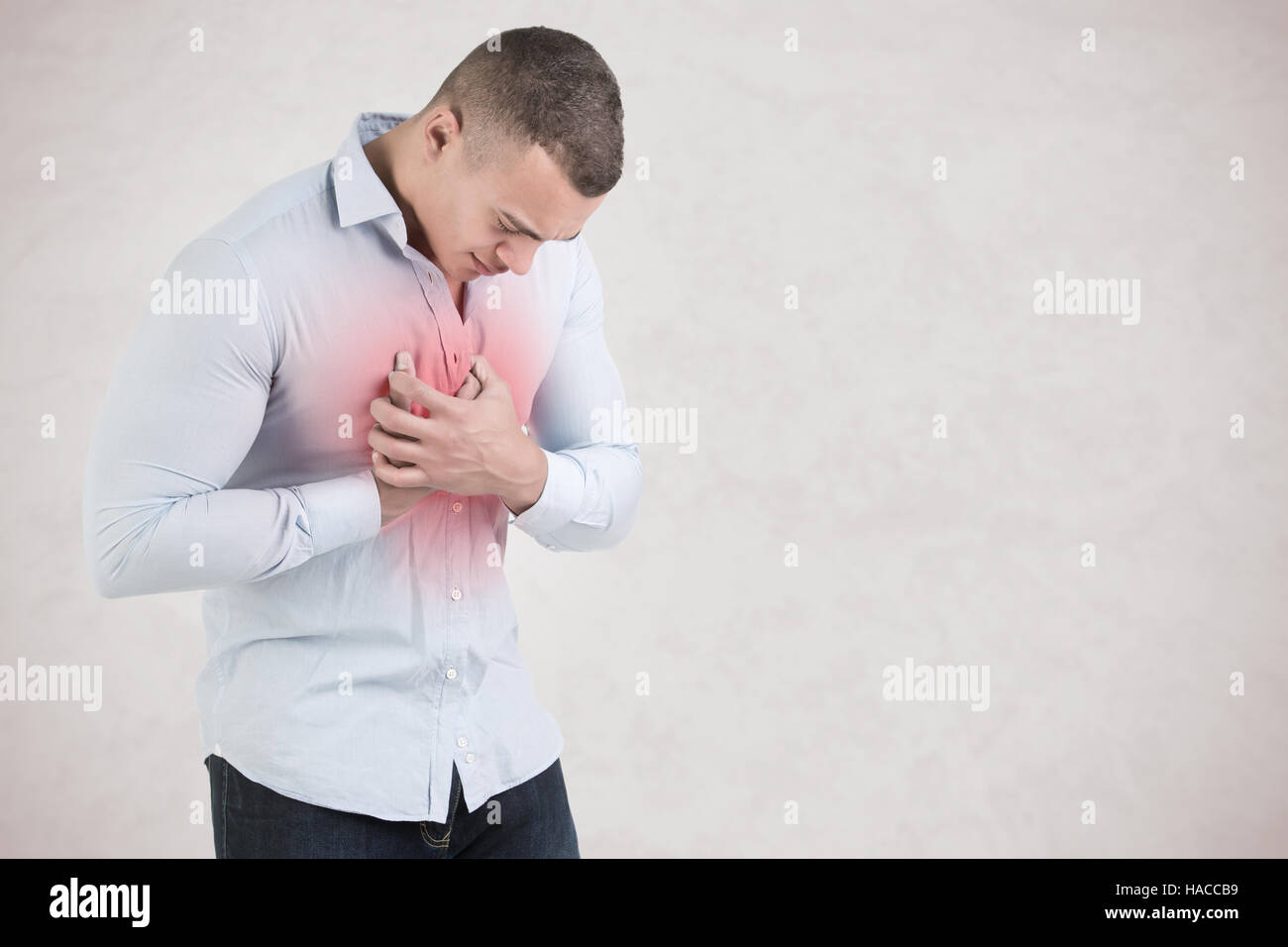 Man having a pain in the heart area Stock Photo