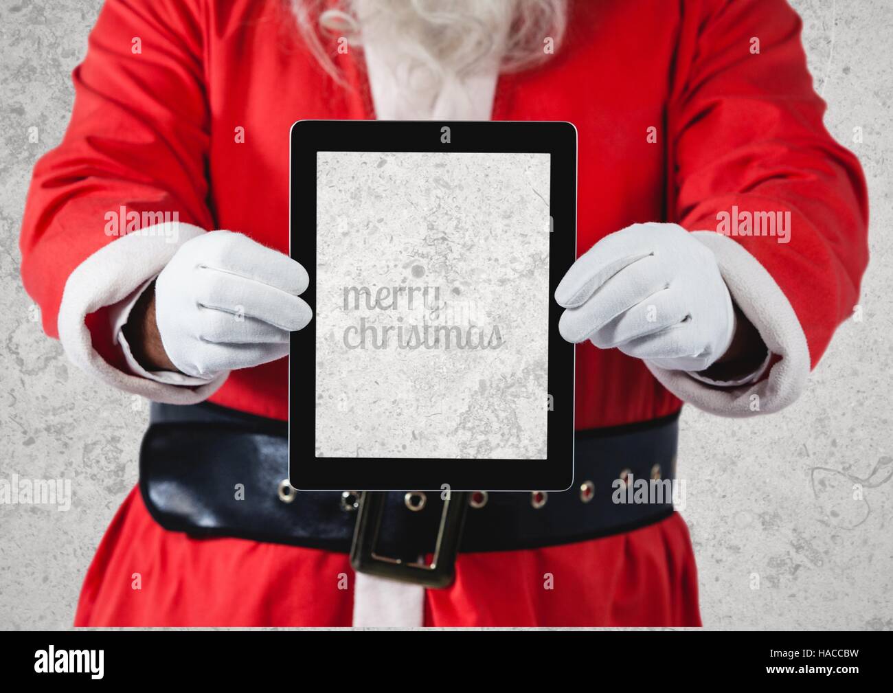 Hands of santa claus holding a digital tablet Stock Photo