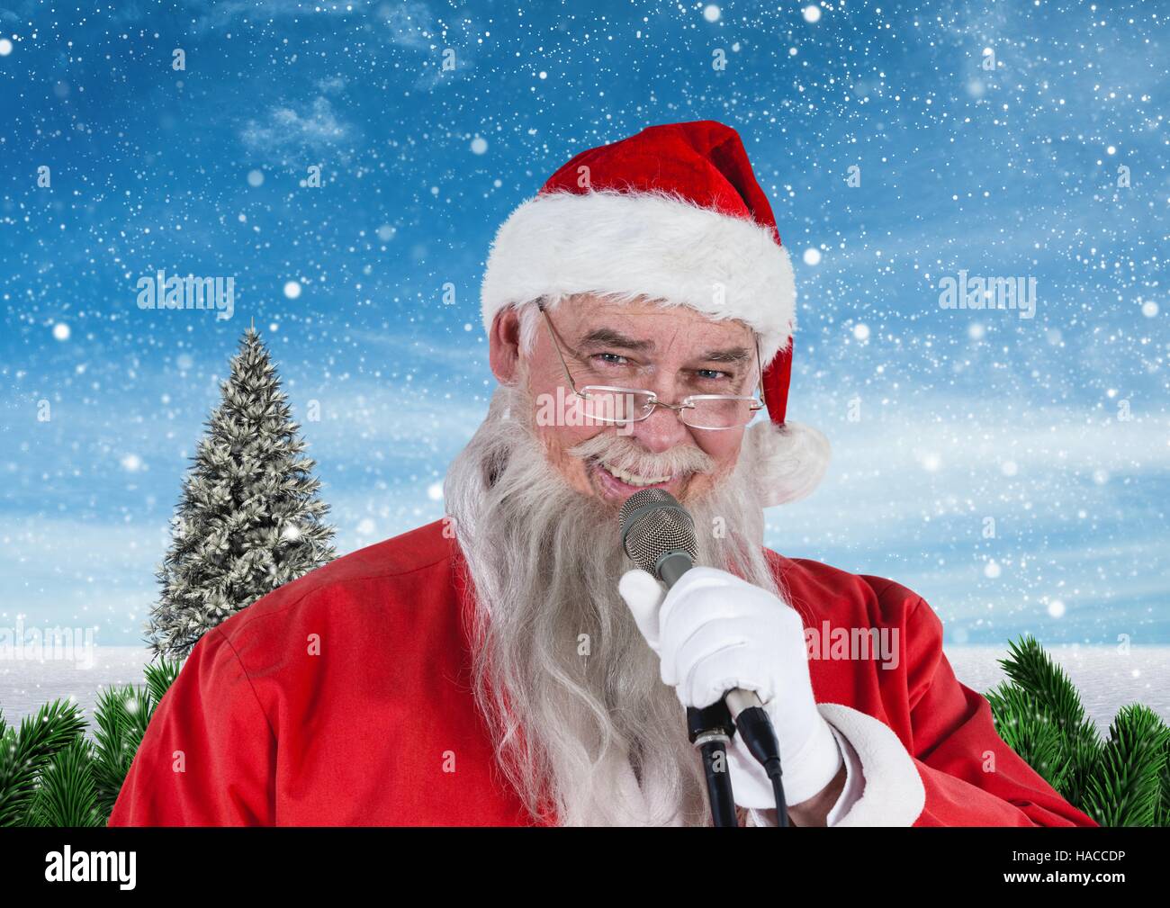 Santa singing christmas song on microphone Stock Photo