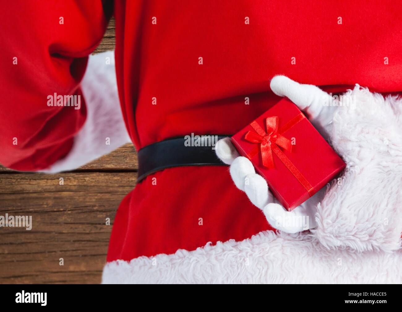 Santa claus holding gift box Stock Photo