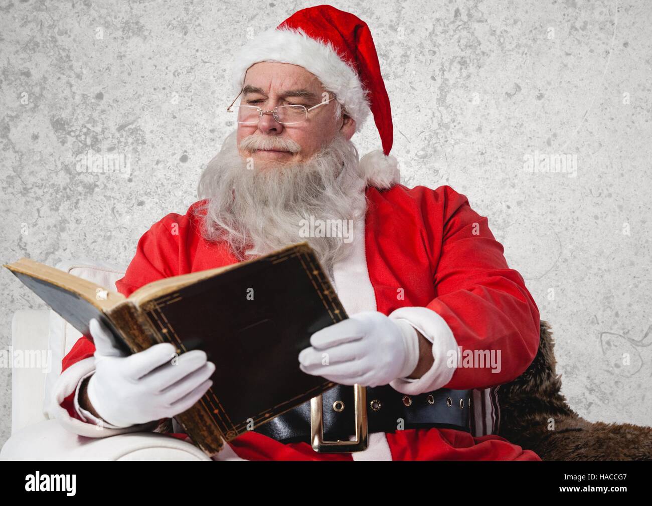 Santa claus reading bible Stock Photo Alamy