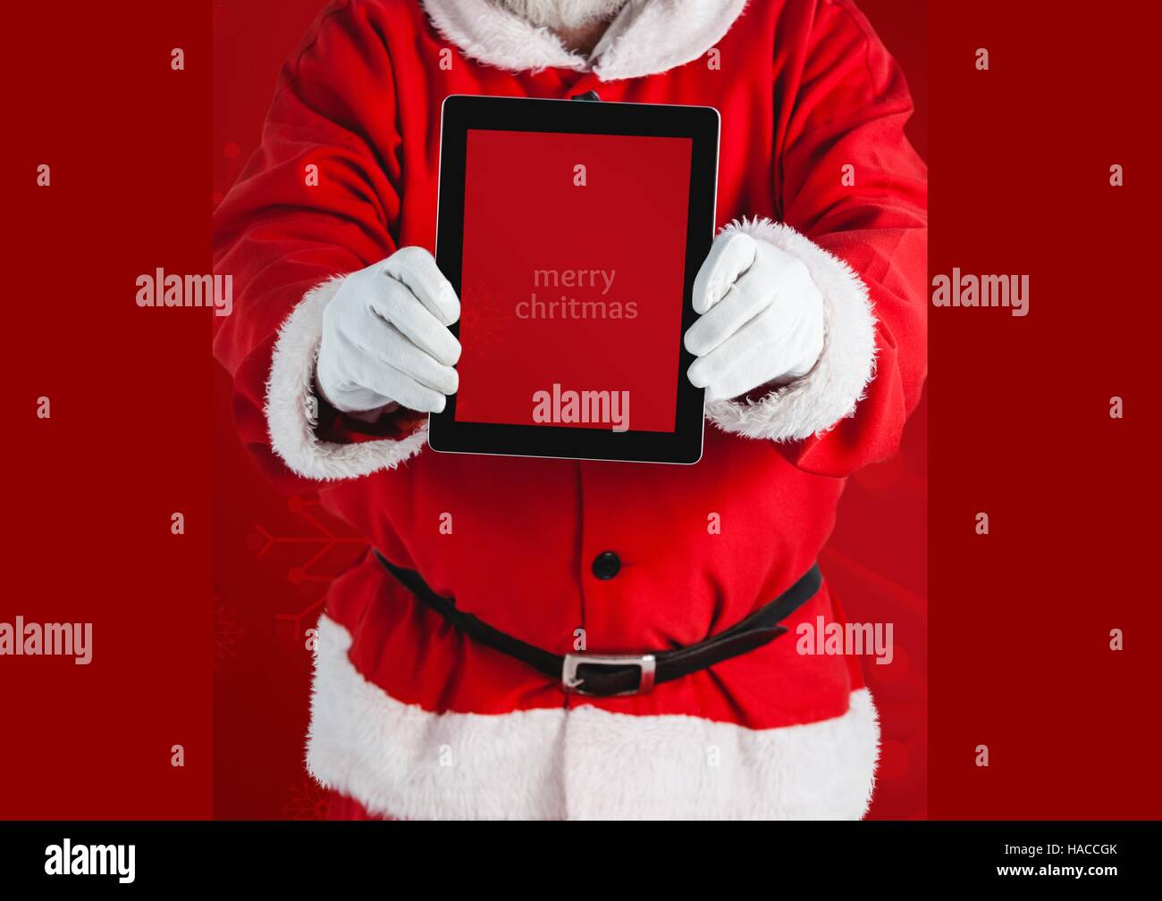 Santa claus holding a digital tablet Stock Photo - Alamy