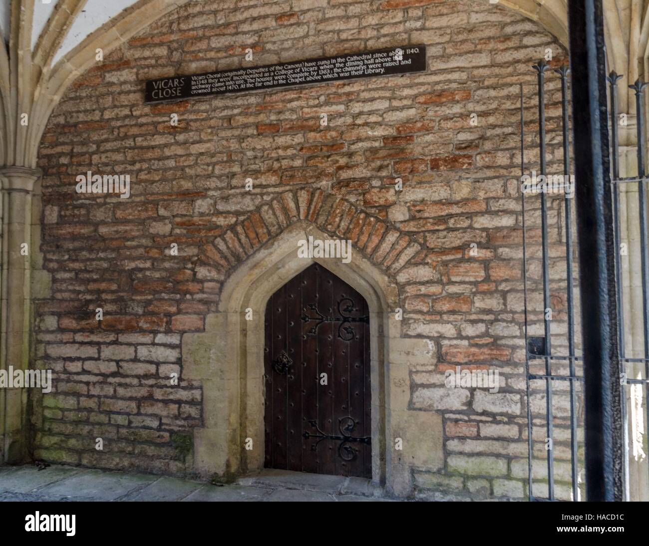The archway at the entrance to the historic street of Vicar's Close in Wells, Somerset, England Stock Photo