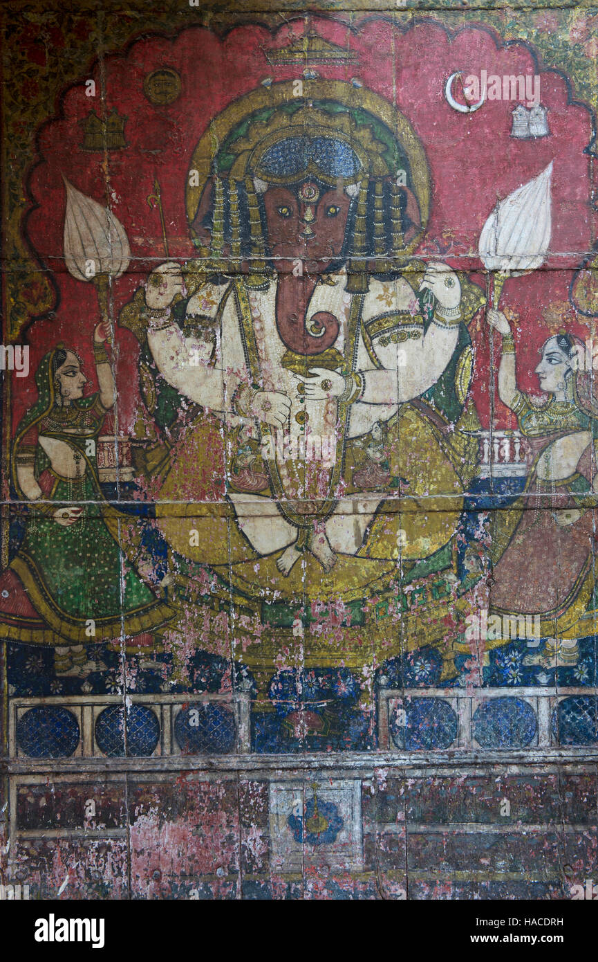 Rajasthani painting of Lord Ganesha painting on wall, City Palace, Udaipur, Rajasthan, India Stock Photo