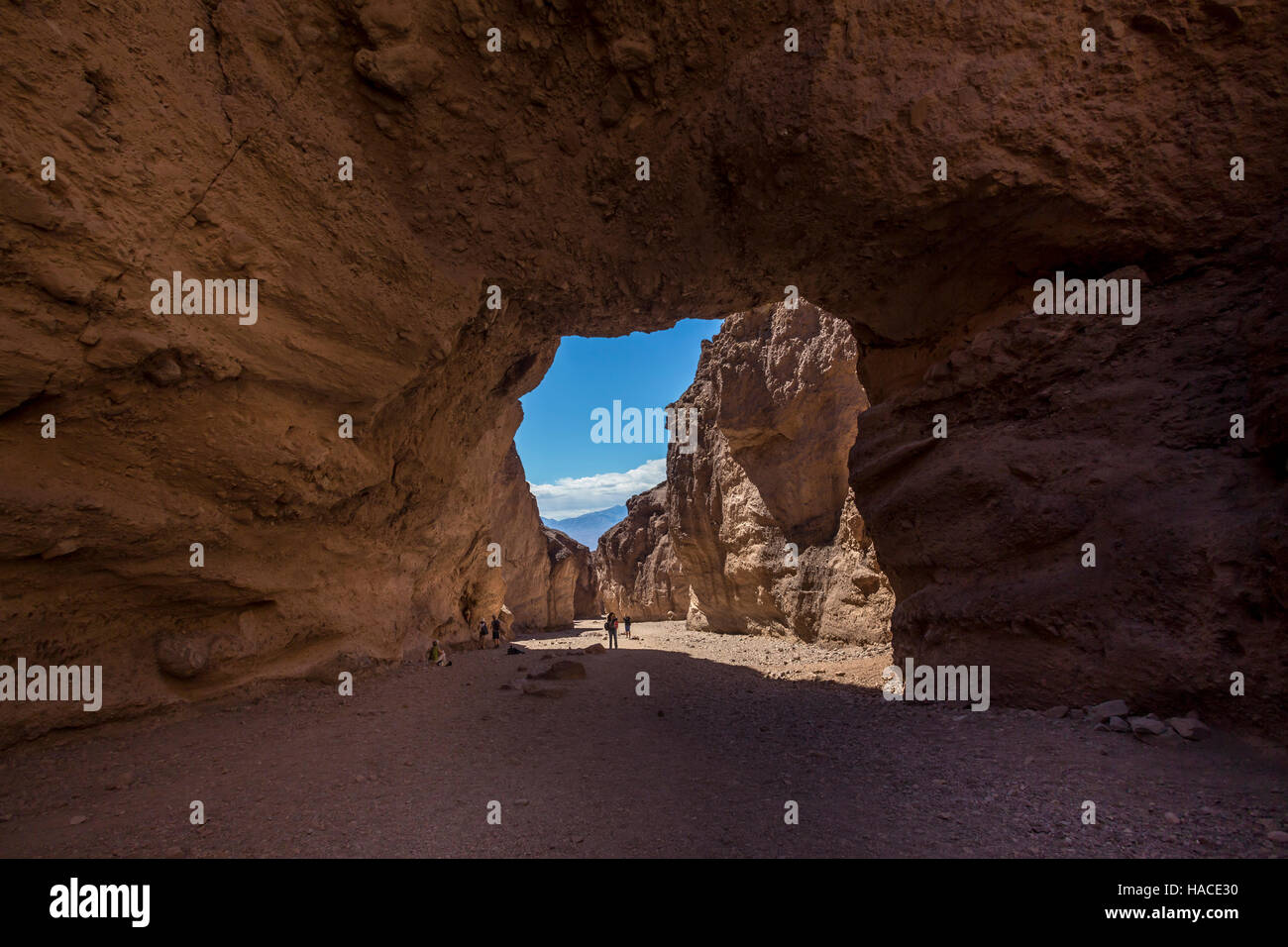 tourists, visiting, Natural Bridge, Natural Bridge Canyon, Death Valley National Park, Death Valley, California Stock Photo