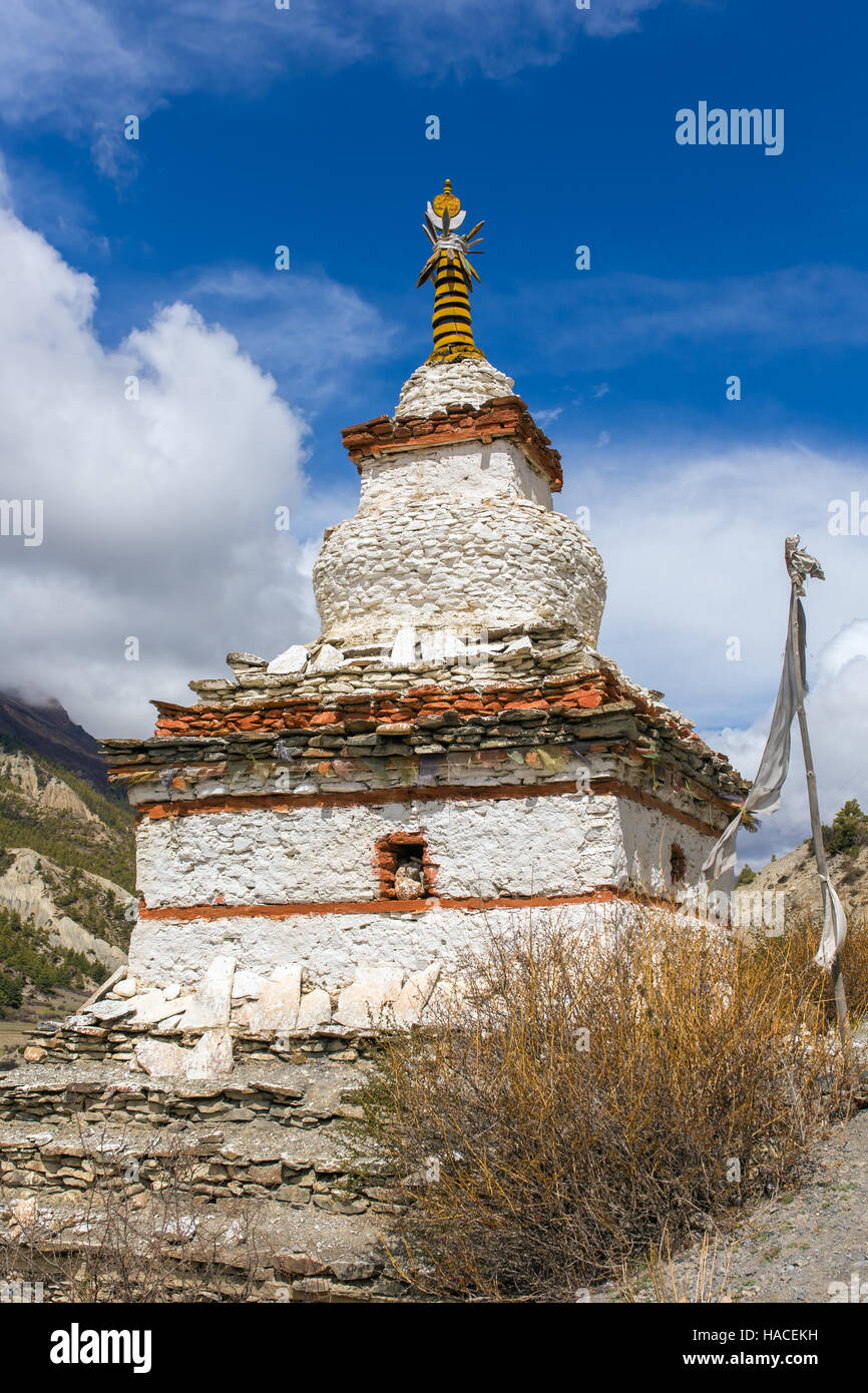 Traditional old Buddhist stupa on Annapurna Circuit Trek in Himalaya mountains, Nepal. Stock Photo
