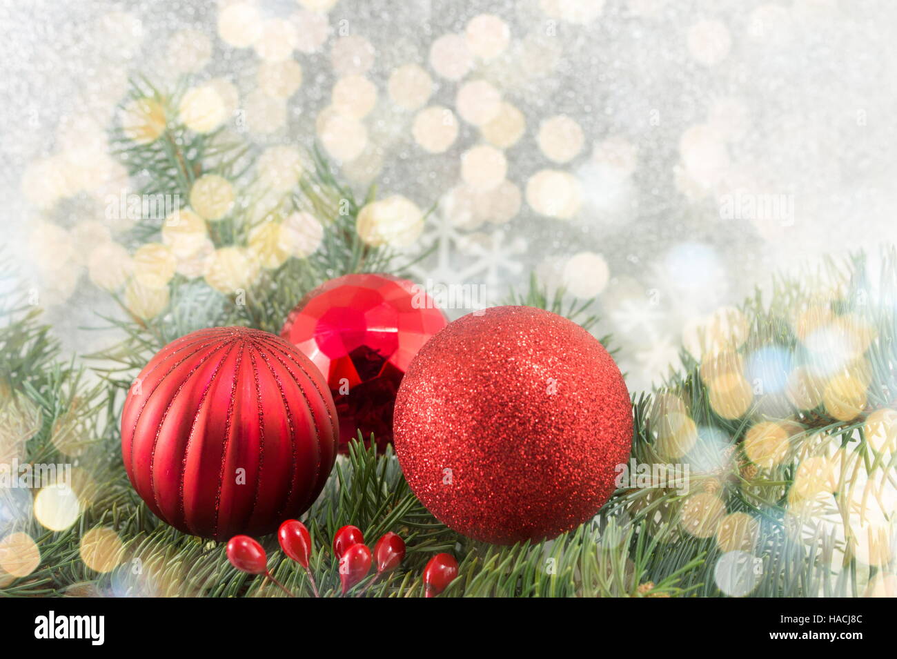 Red Christmas balls on shiny silver background Stock Photo - Alamy