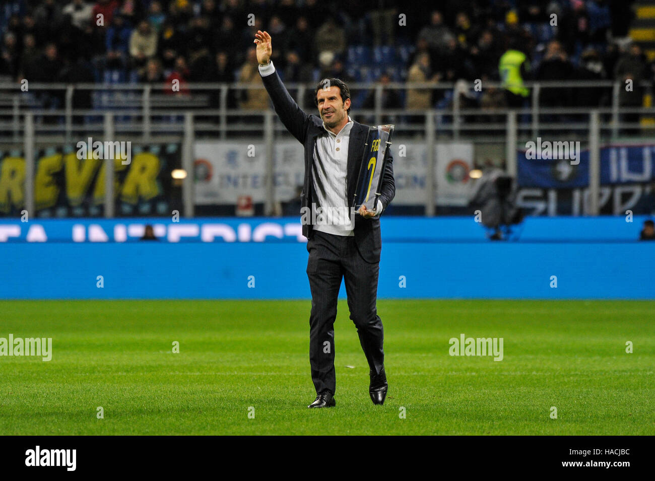 Milan, Italy. 28th Nov, 2016. Former FC Inter player Luis Figo waves as he holds his jersey Before the football match Inter versus Fiorentina. © Gaetano Piazzolla/Pacific Press/Alamy Live News Stock Photo