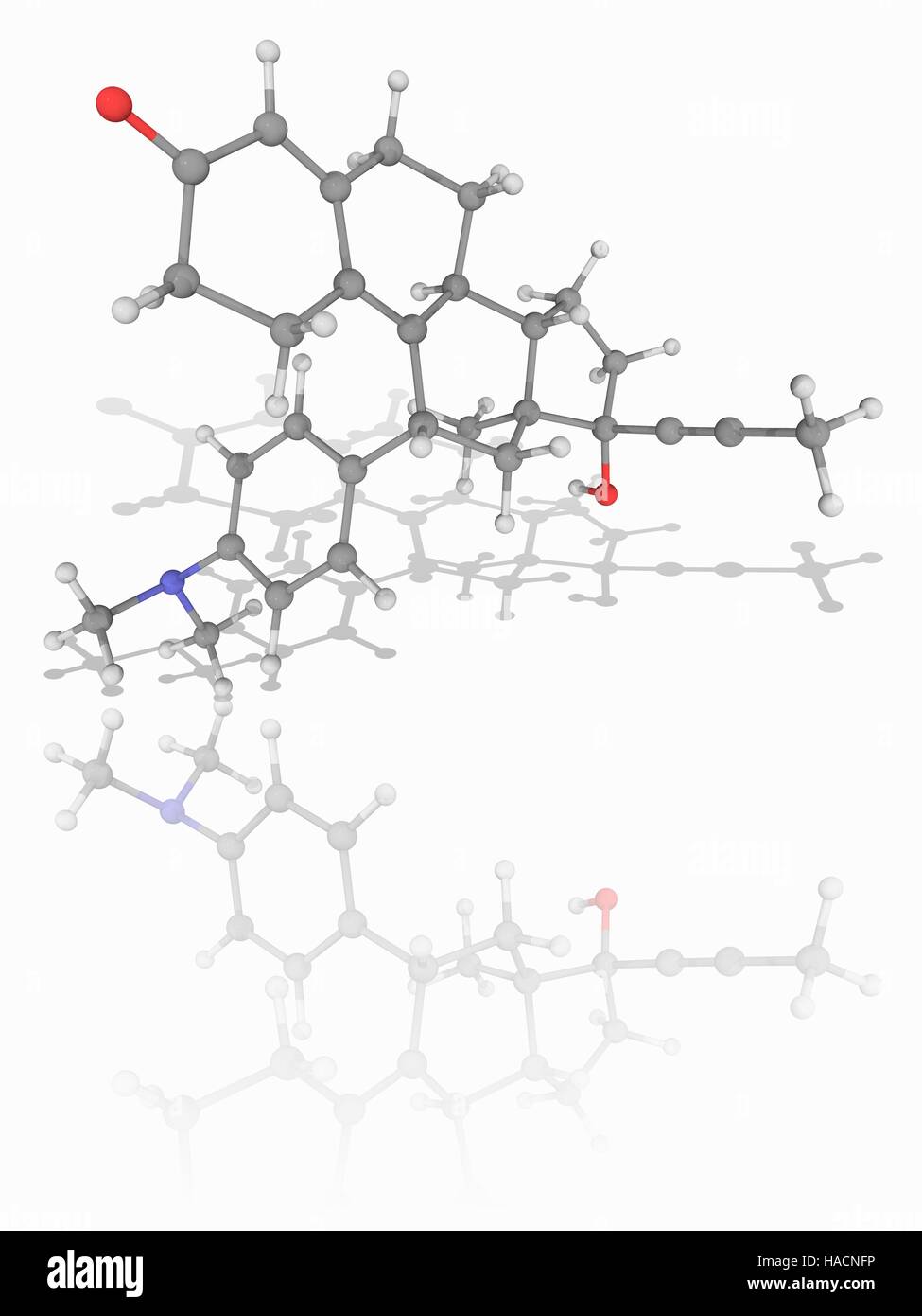 Mifepristone. Molecular model of the progesterone receptor antagonist drug mifepristone (C29.H35.N.O2), used to induce abortions and as an emergency contraceptive. Atoms are represented as spheres and are colour-coded: carbon (grey), hydrogen (white), nitrogen (blue) and oxygen (red). Illustration. Stock Photo