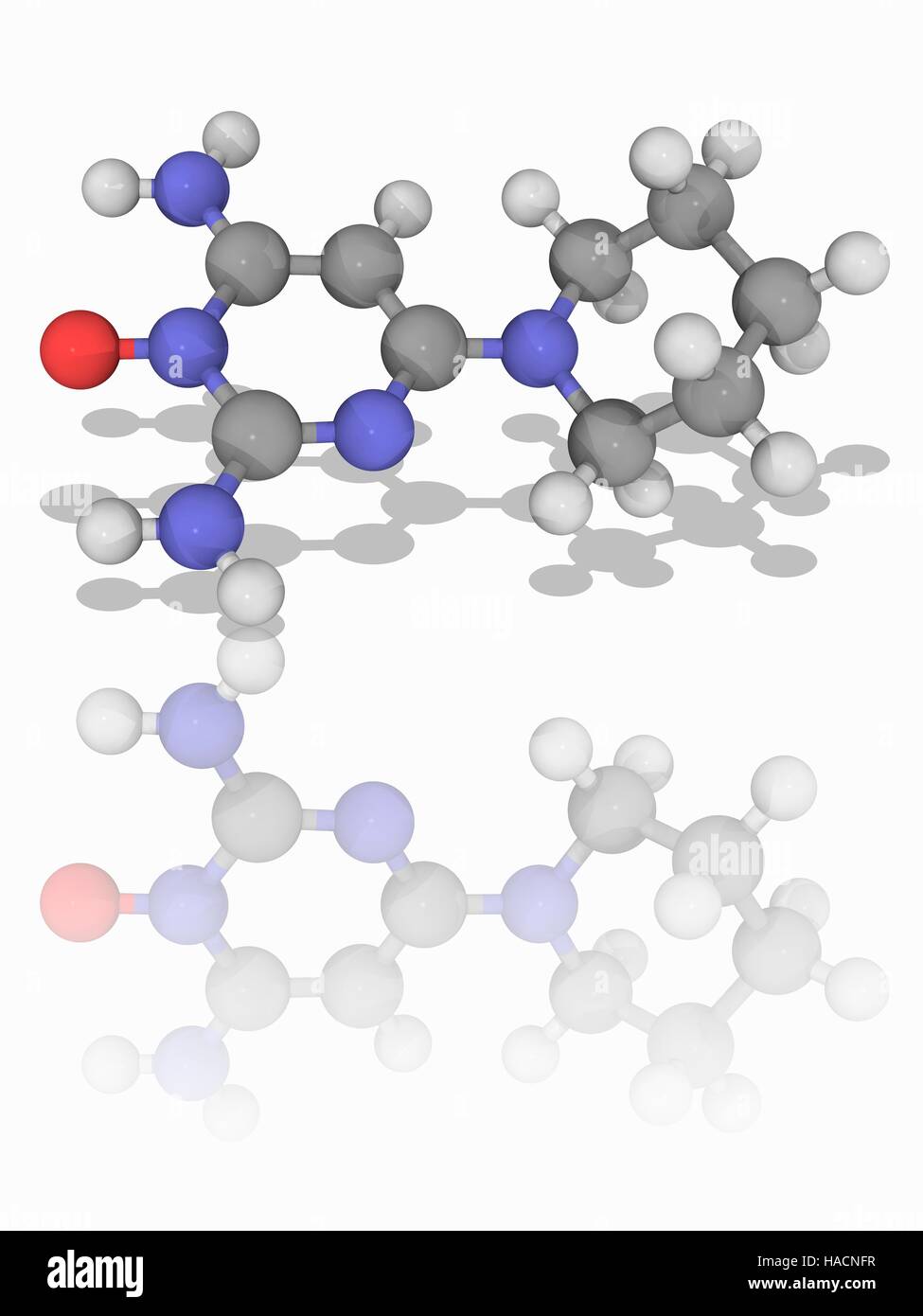 Minoxidil. Molecular model of the drug minoxidil (C9.H15.N5.O), an anti-hypertensive vasodilator used to treat hair loss and to promote hair regrowth. It is also known as Rogaine. Atoms are represented as spheres and are colour-coded: carbon (grey), hydrogen (white), nitrogen (blue) and oxygen (red). Illustration. Stock Photo