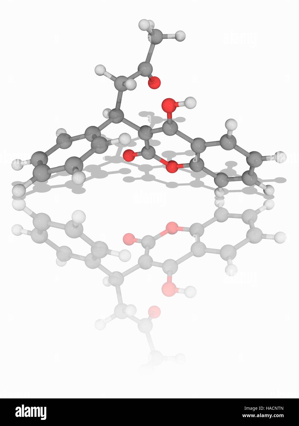 Warfarin. Molecular model of the drug warfarin (C19.H16.O4), used as an anticoagulant. Trade names include Coumadin, Jantoven, and Marevan. Atoms are represented as spheres and are colour-coded: carbon (grey), hydrogen (white) and oxygen (red). Illustration. Stock Photo