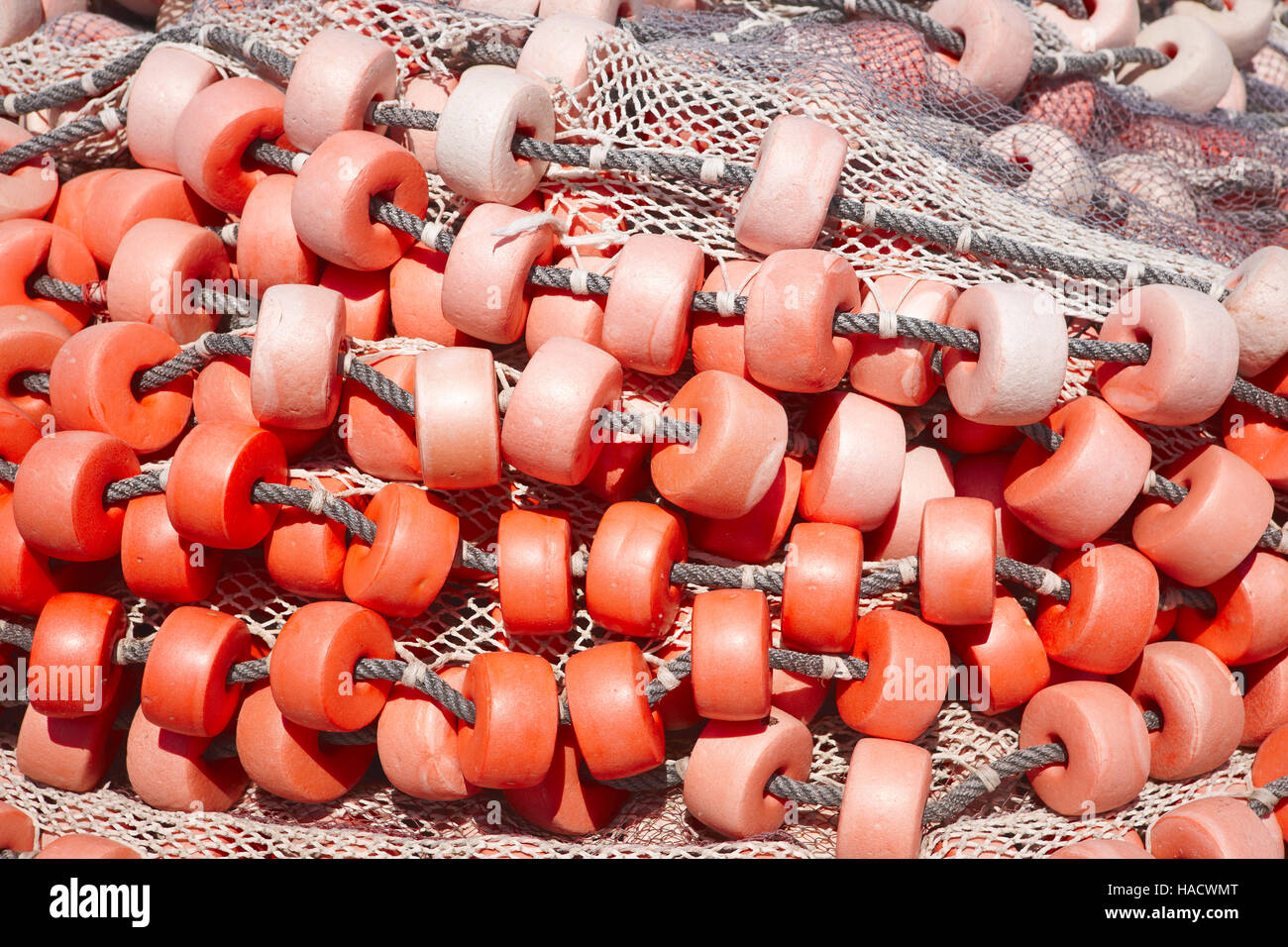 Fishermans net detail background in red tone. Horizontal Stock Photo