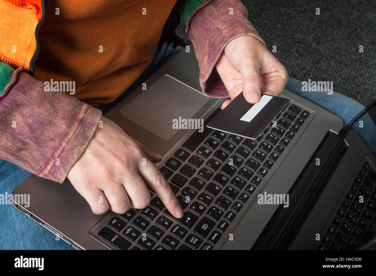 Woman holding credit card on laptop for on line shopping concept. Selective focus. Stock Photo