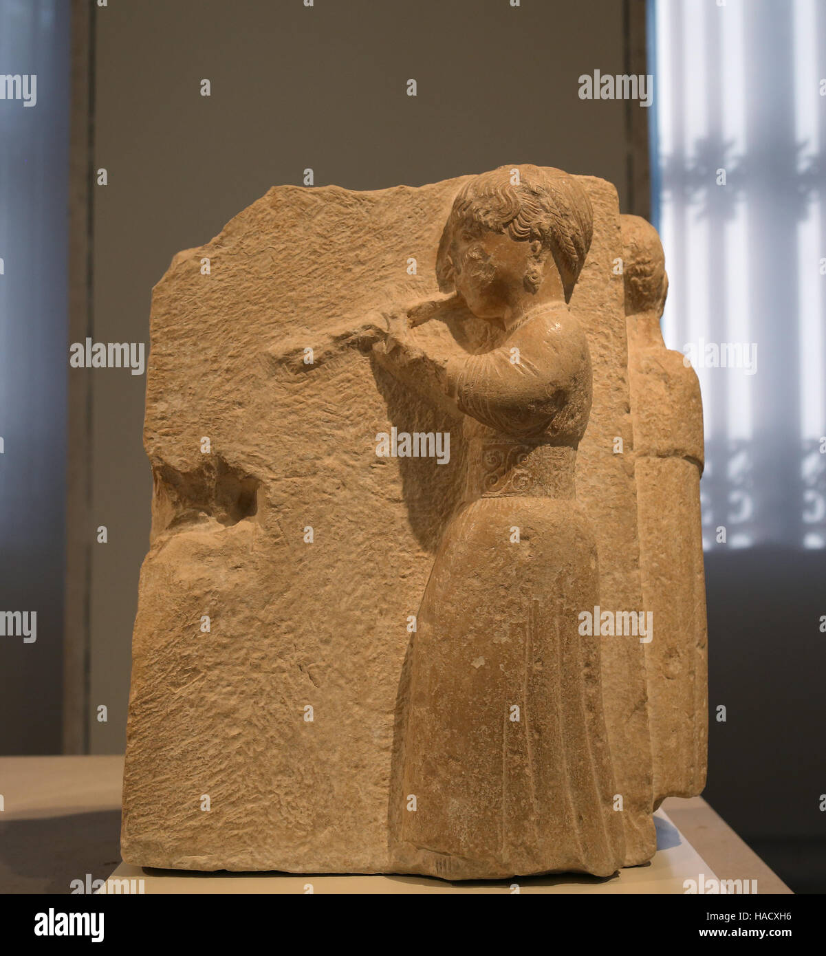 Auletris (aulos playing woman). Iberian relief of Osuna, Seville province, Spain. 3rd-2nd BCE. National Archaeological Museum, Madrid. Spain. Stock Photo