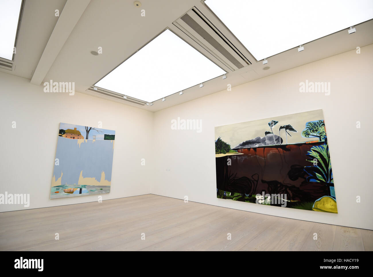 Works by Dexter Dalwood titled 'Bay of Pigs' and 'Brian Jones' Swimming Pool' (right) displayed at a photo call and press view for the Saatchi Gallery's winter exhibition Painters' Painters at the gallery in Chelsea, west London. Stock Photo
