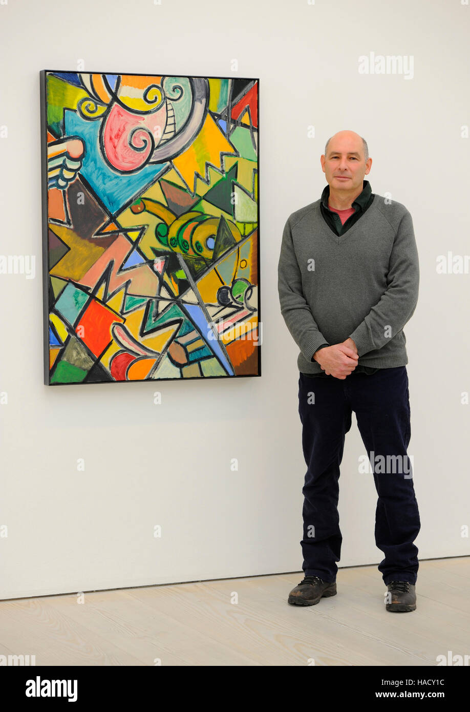 Artist Ansel Krut stands next to his painting titled Shattered Man at a photo call and press view for the Saatchi Gallery's winter exhibition Painters' Painters at the gallery in Chelsea, west London. Stock Photo