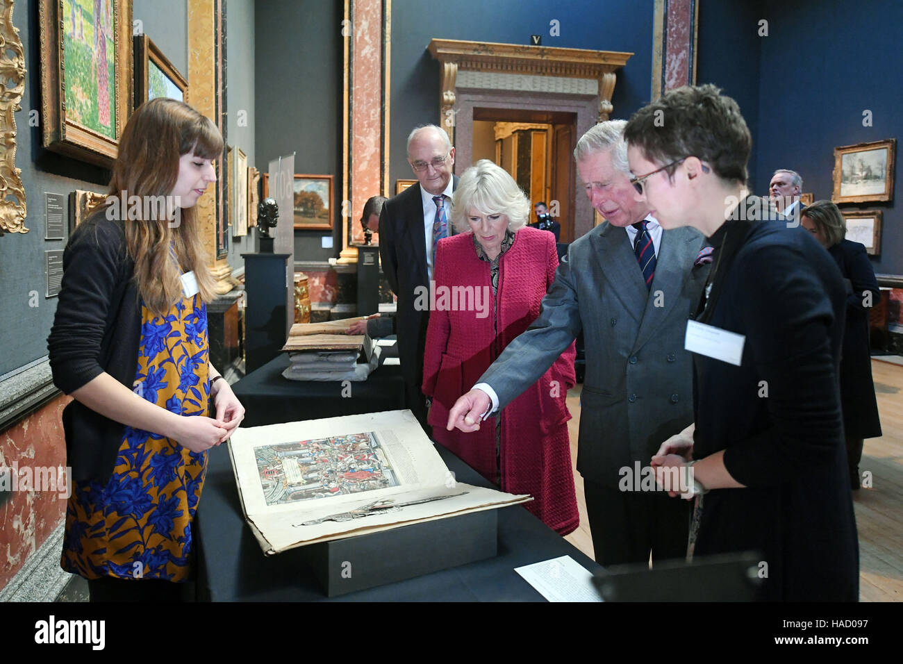 The Prince of Wales and the Duchess of Cornwall examine a copy of Andreas Vesalius' De Humani Corporis Fabrica Librorum Epitome (1543) during a visit to the University of Cambridge's Fitzwilliam Museum to mark its bicentenary and to celebrate the 600th anniversary of the Cambridge University Library. Stock Photo