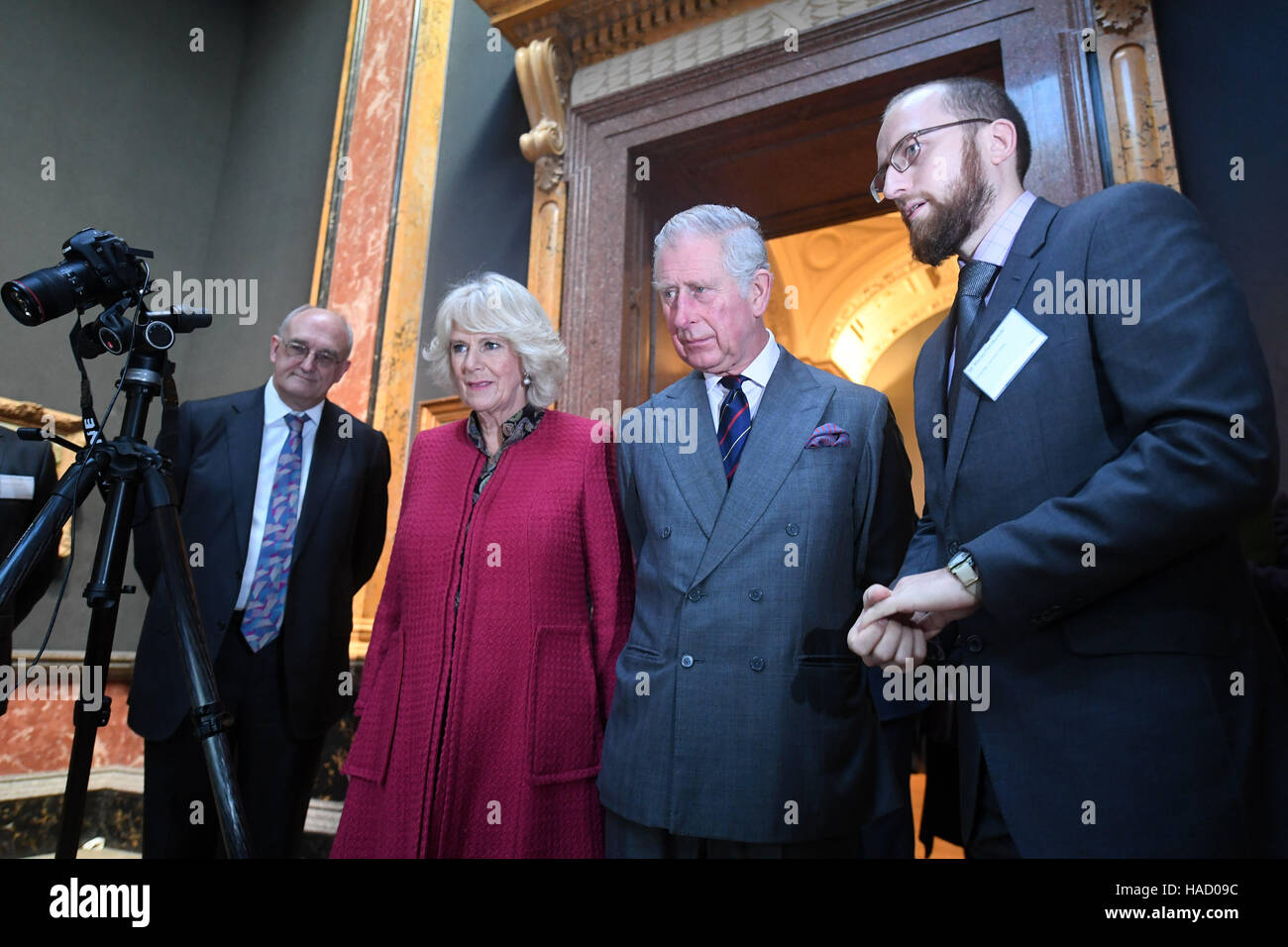 The Prince of Wales and the Duchess of Cornwall are given a demonstration of digitisation techniques during a visit to the University of Cambridge's Fitzwilliam Museum to mark its bicentenary and to celebrate the 600th anniversary of the Cambridge University Library. Stock Photo