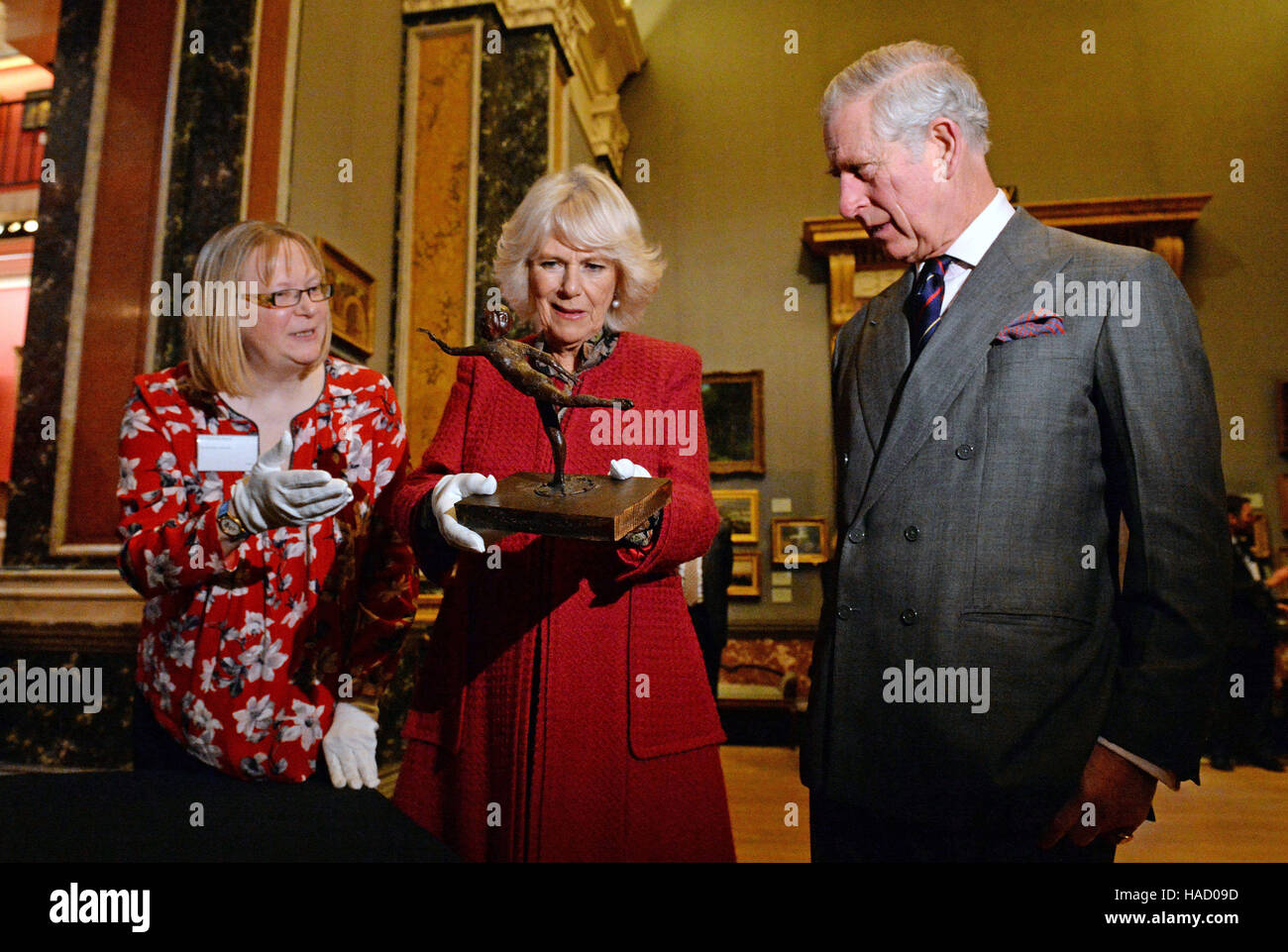 The Duchess of Cornwall holds a wax sculpture by Edgar Degas titled Arabesque over the Right Leg, Left Arm in Front as she and the Prince of Wales visit the University of Cambridge's Fitzwilliam Museum to mark its bicentenary and to celebrate the 600th anniversary of the Cambridge University Library. Stock Photo