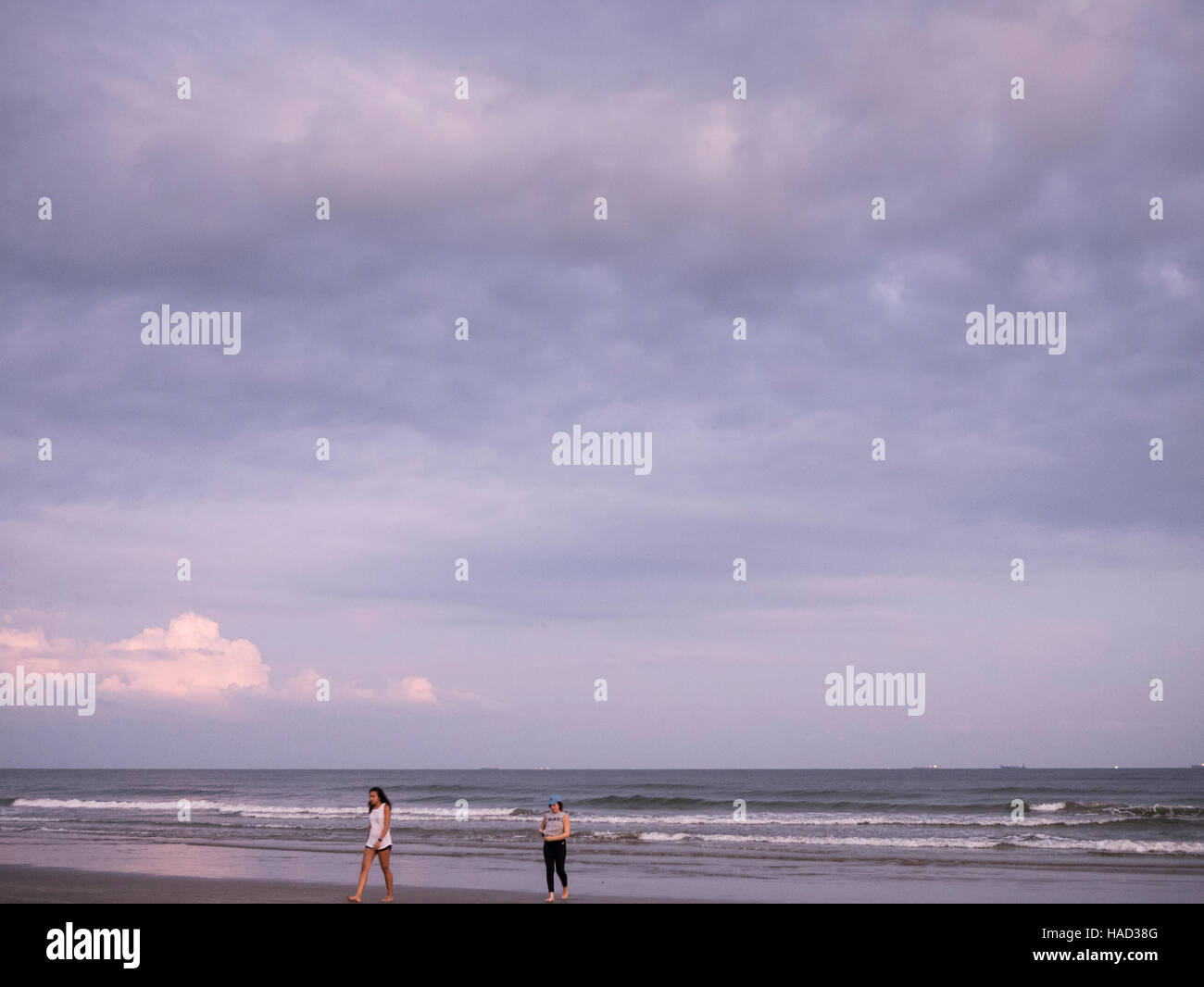 Galveston island beach near historic pleasure pier along seawall