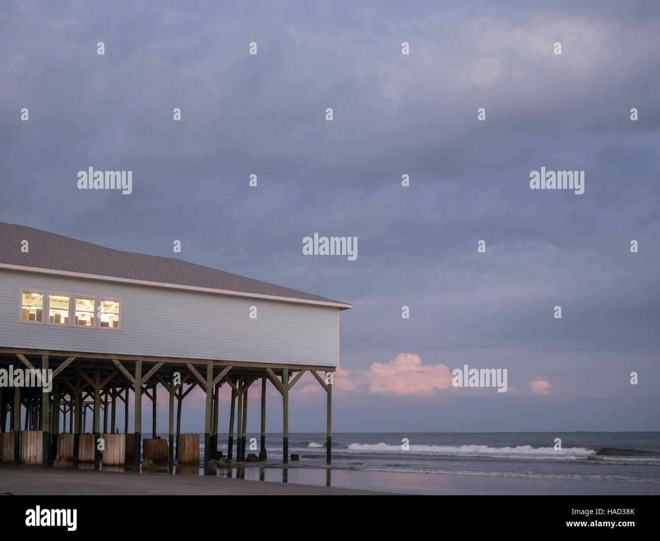 Galveston island beach near historic pleasure pier along seawall