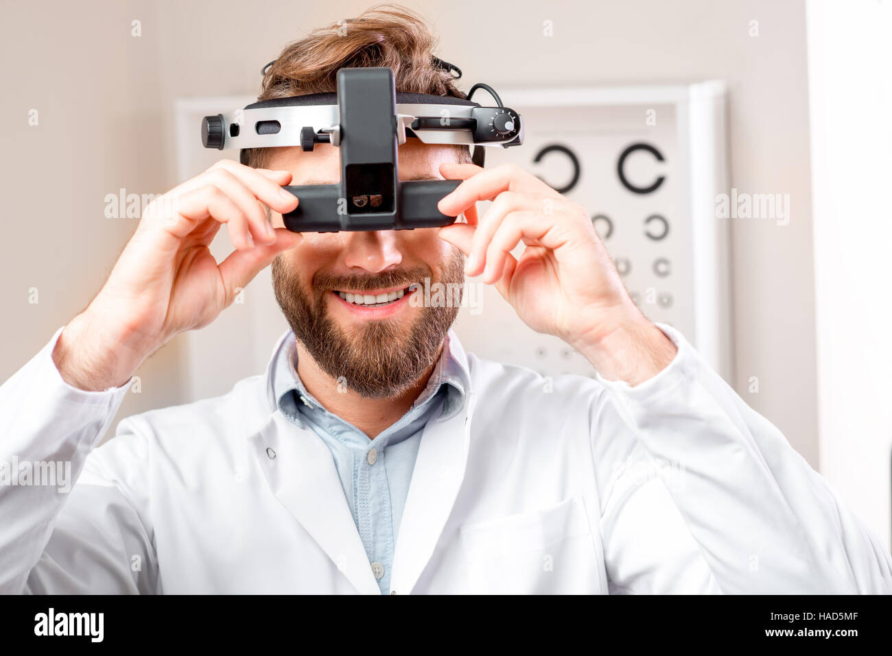 Eye doctor with binocular device Stock Photo