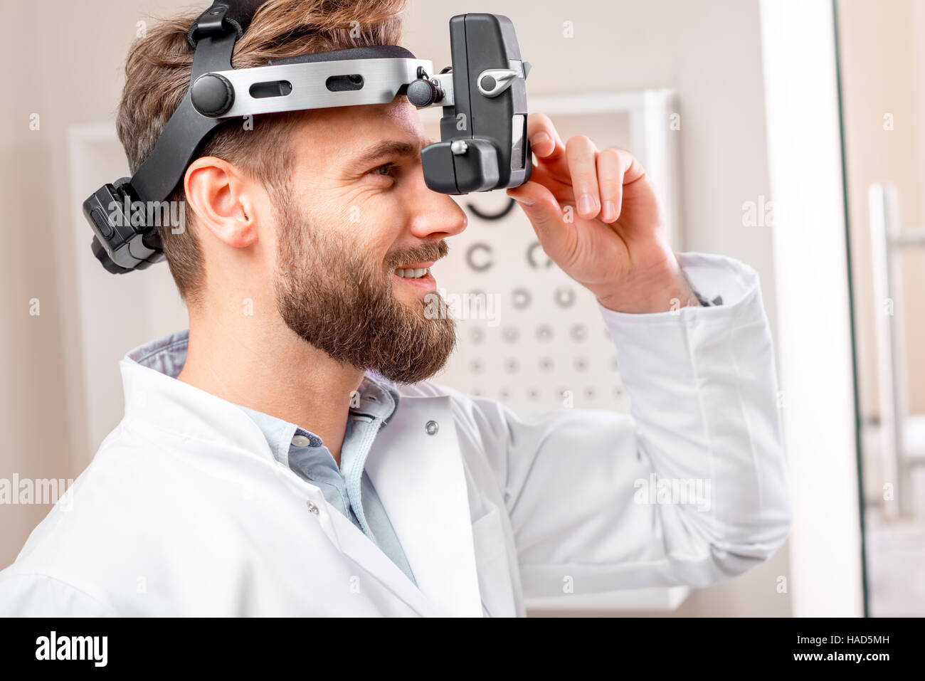 Eye doctor with binocular device Stock Photo