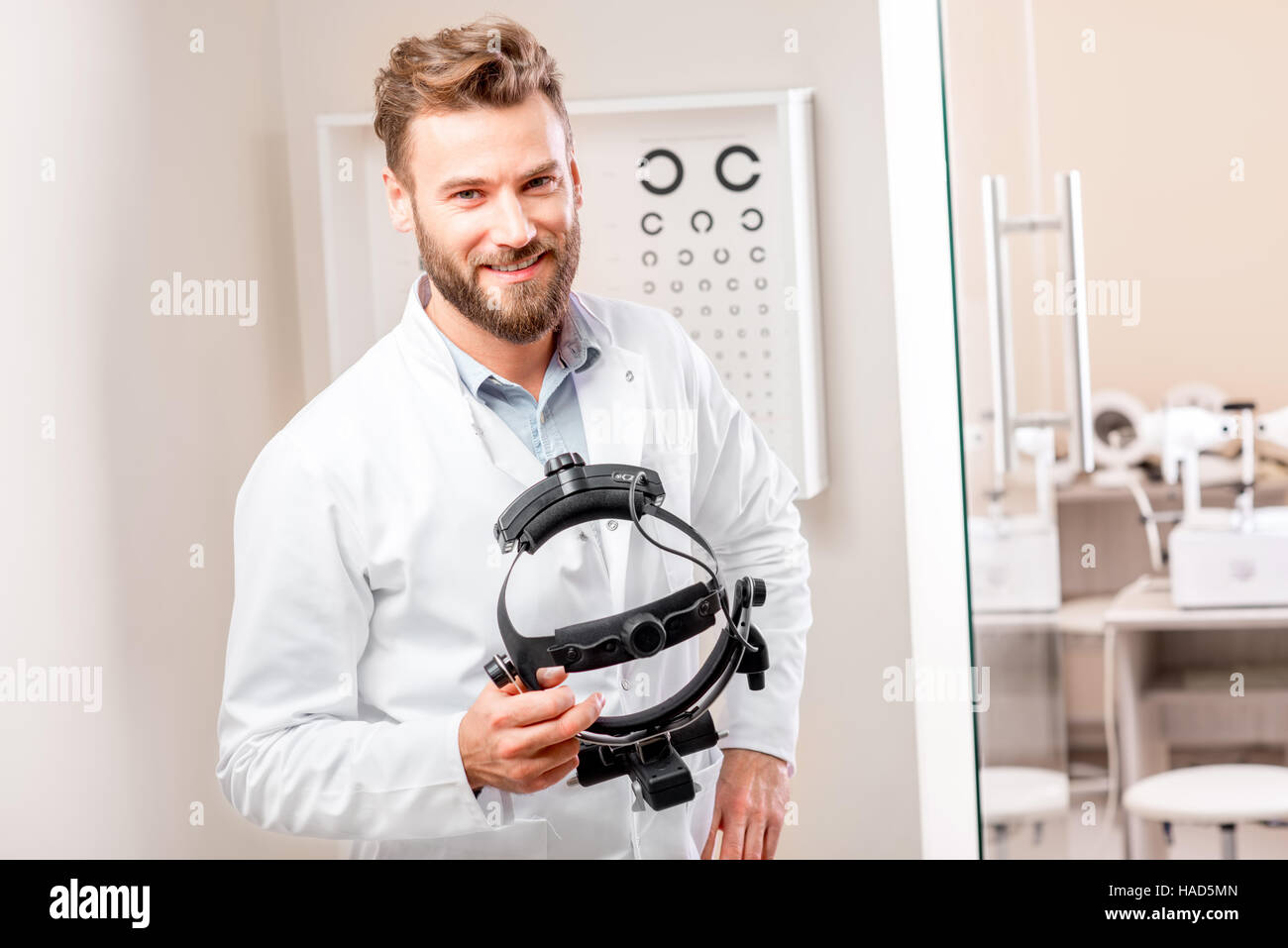 Eye doctor with binocular device Stock Photo