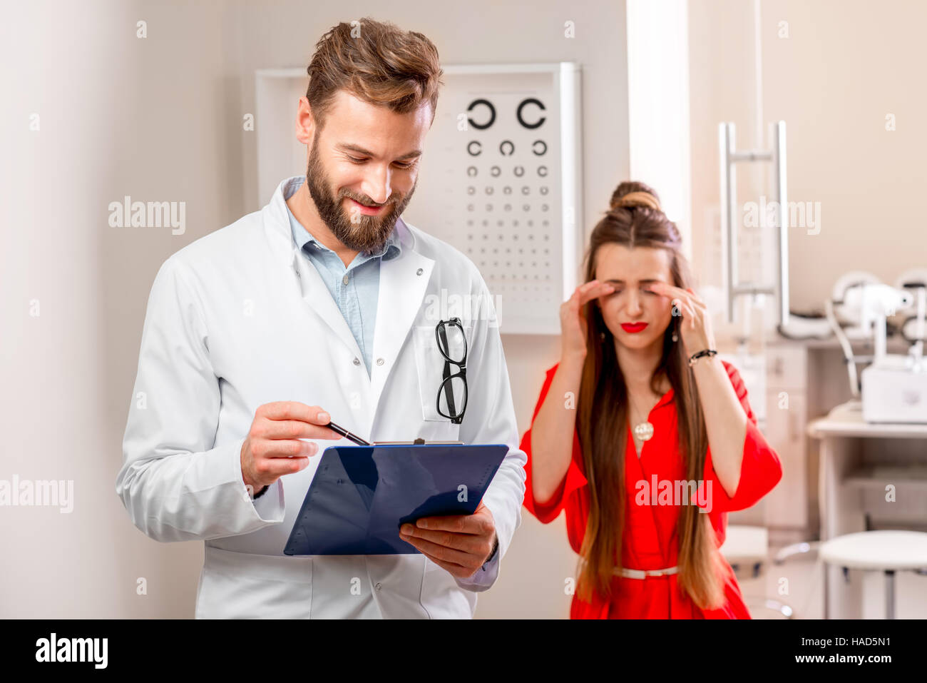Eye doctor with unhappy patient Stock Photo