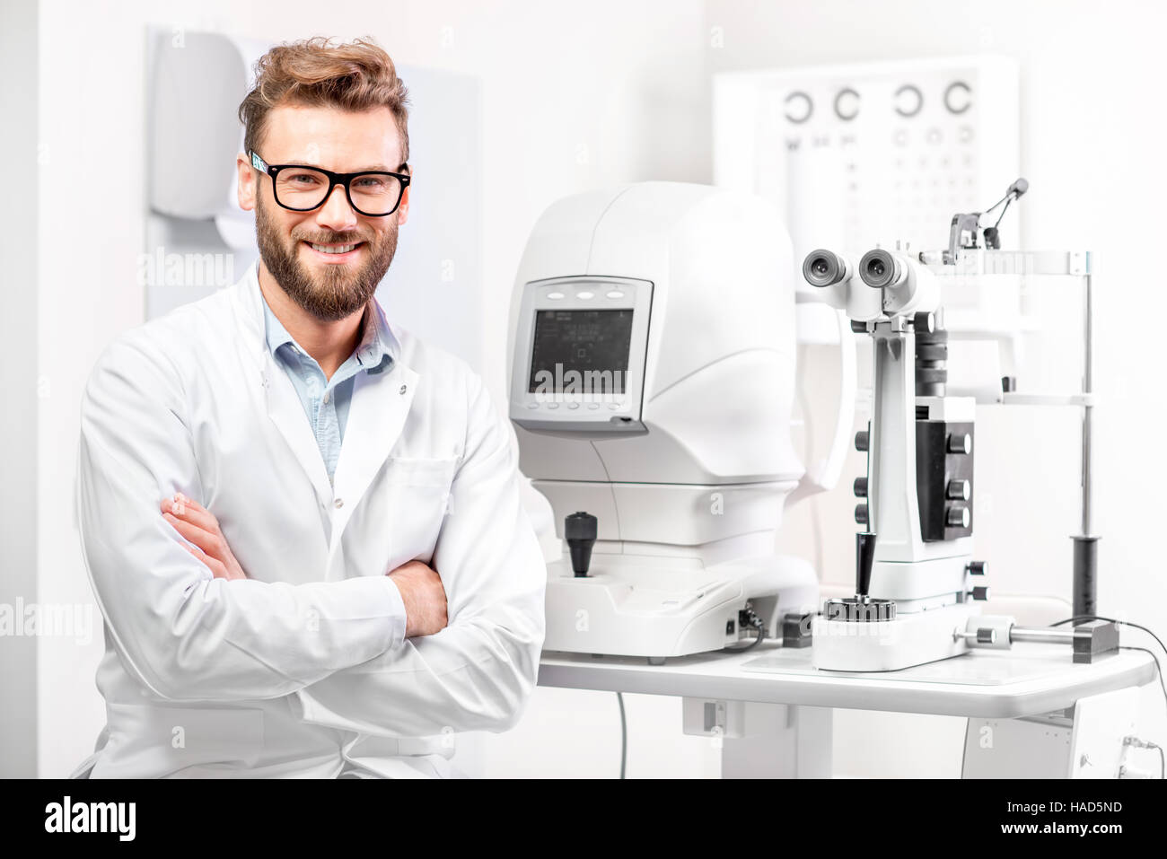 Eye doctor with ophthalmologic device Stock Photo