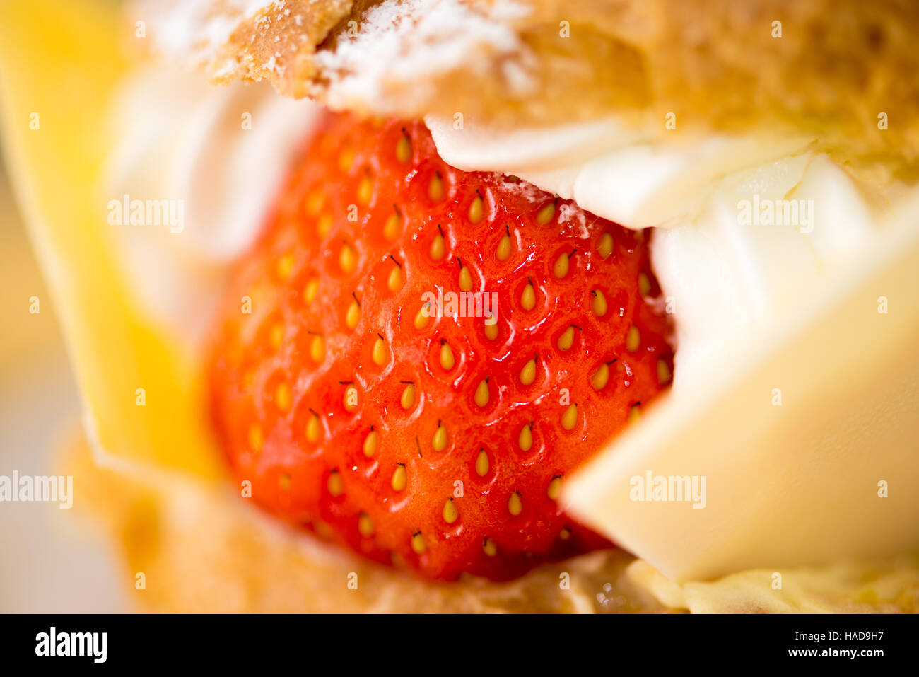 Fresh strawberry with cream of a strawberry puff, close up Stock Photo