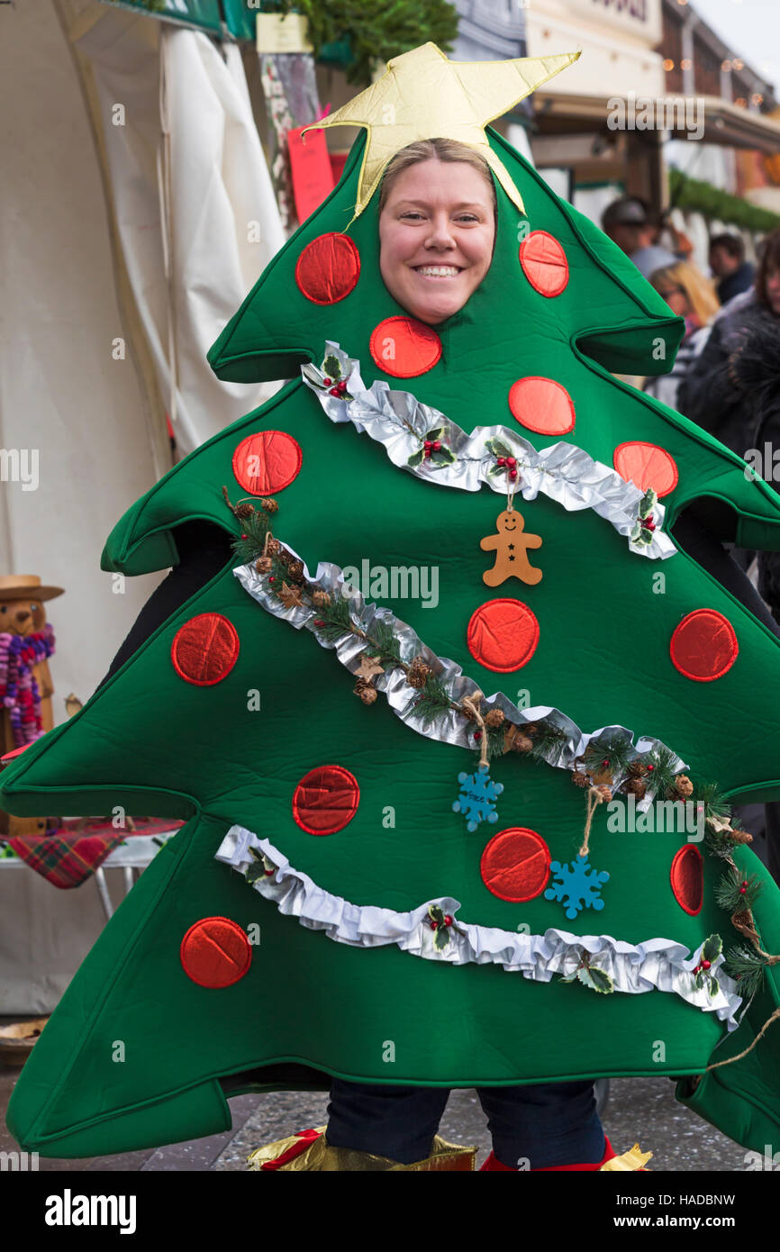 Woman dressed up as Christmas Tree at Victorian Festival of Christmas at Portsmouth, Hampshire, England UK in November Stock Photo