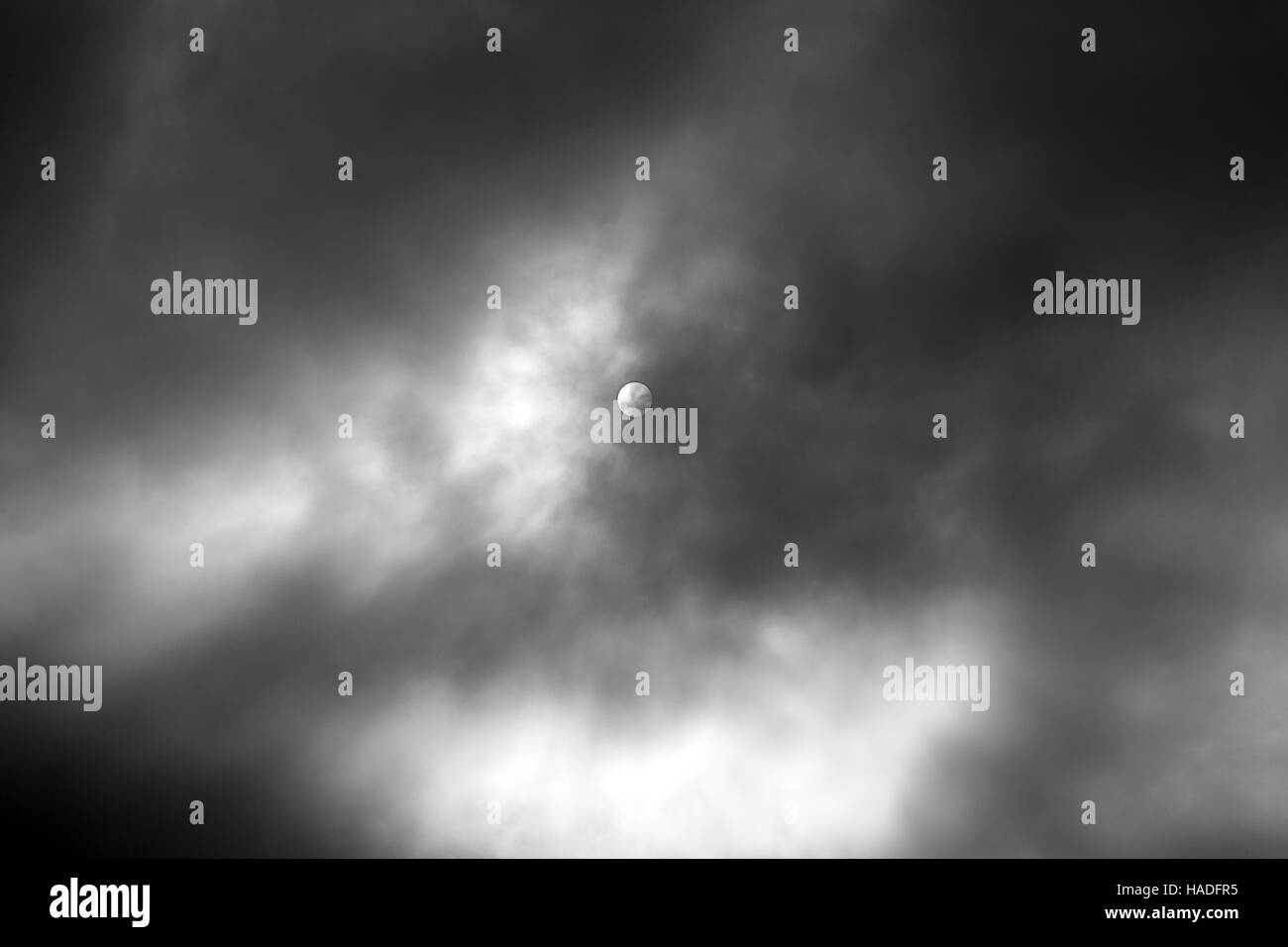 Sun in cloudy sky Black and White Stock Photos & Images - Alamy