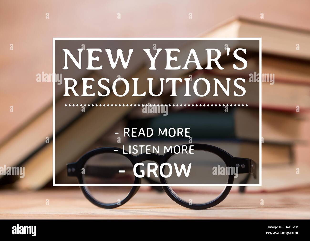 New year resolution goals against books and spectacles Stock Photo