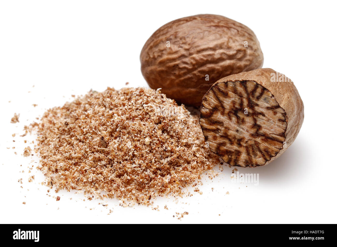 Nutmeg and ground nutmeg on white background Stock Photo Alamy