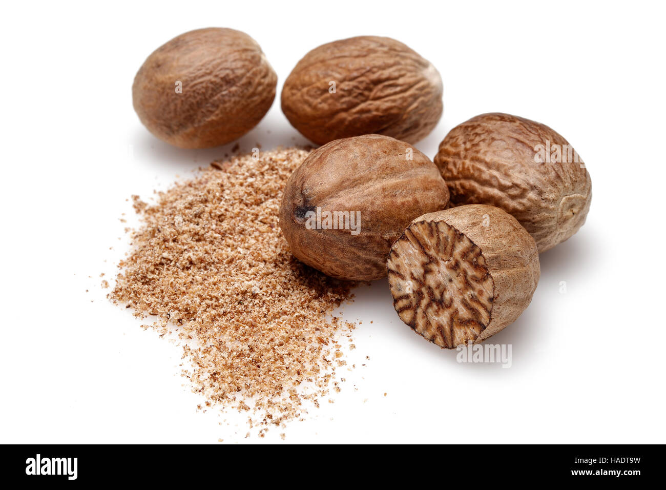 Nutmeg and ground nutmeg on white background Stock Photo Alamy