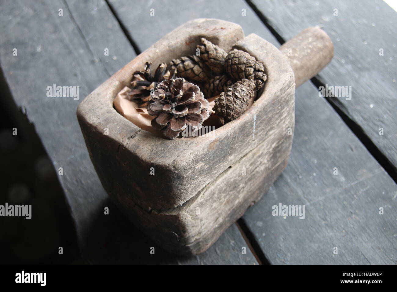 pine cone Christmas decoration on old rustic wooden table Stock Photo