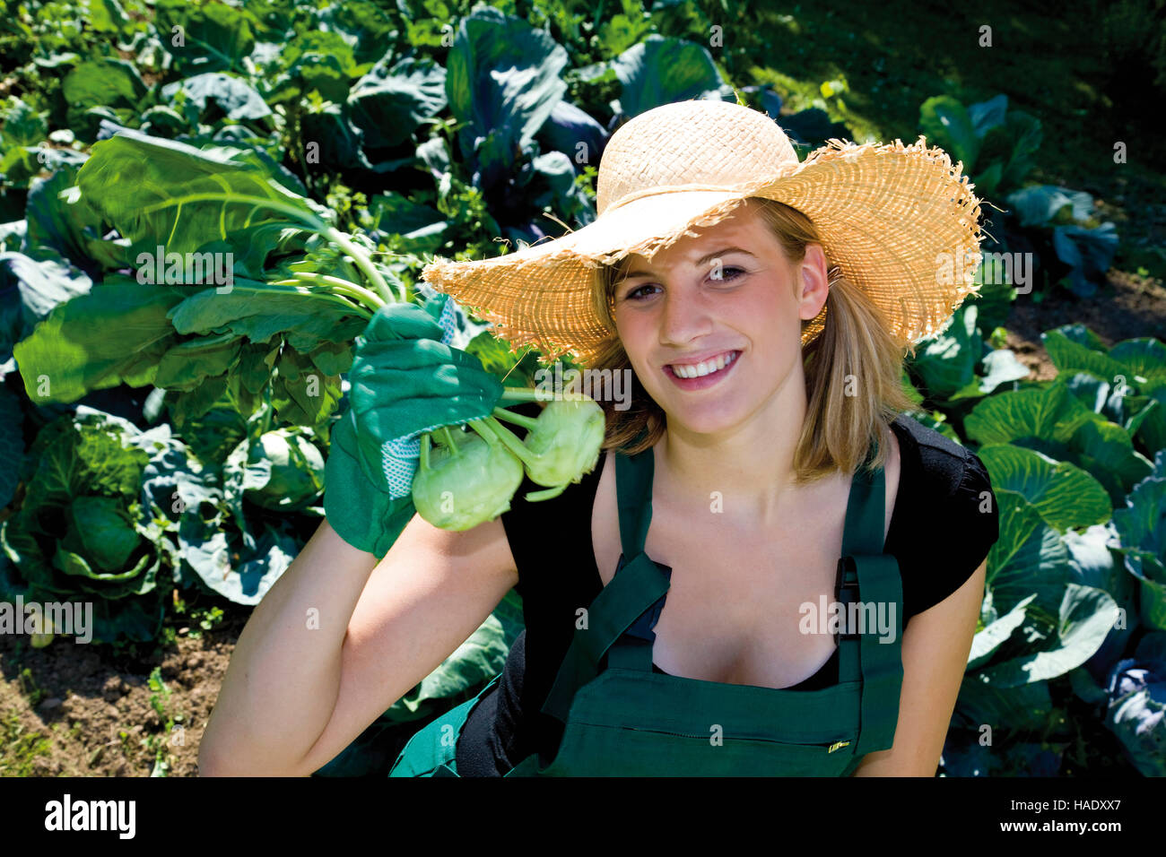 Female gardener with turnip cabbage Stock Photo
