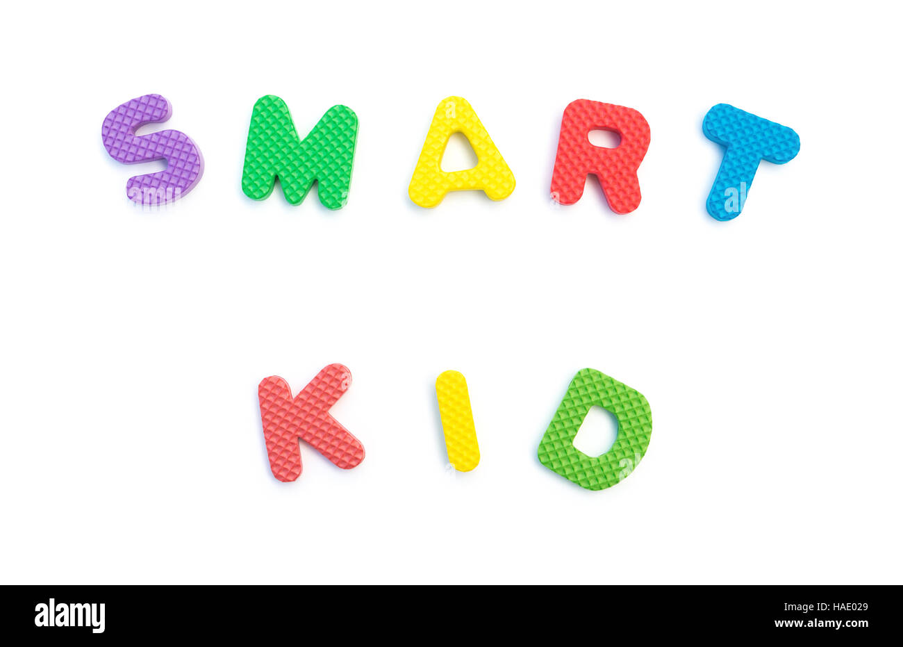 word of smart kid shaped by alphabet puzzles on white Stock Photo