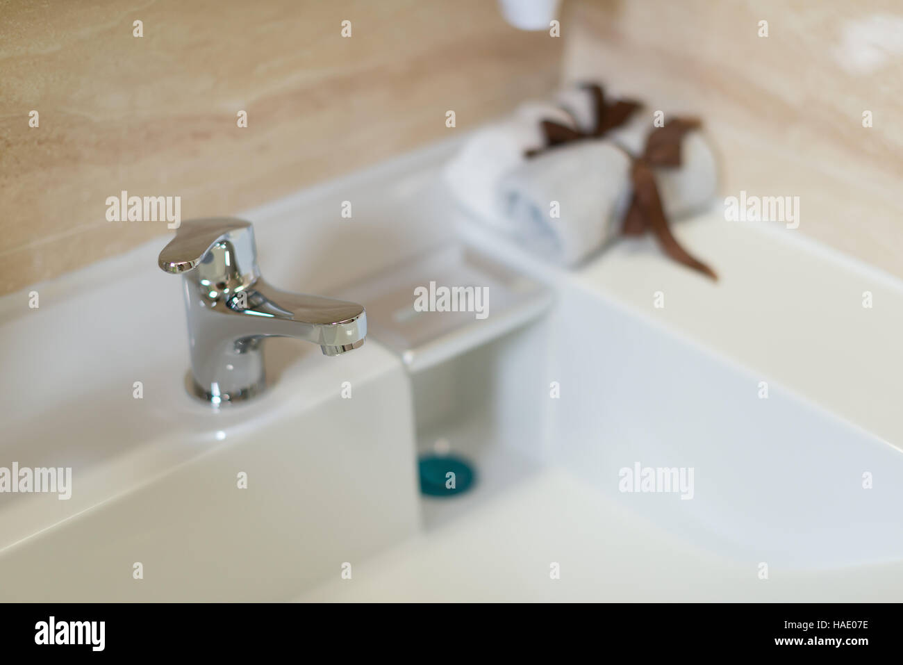clean washbasin and stainless steel tap in a bathroom Stock Photo Alamy