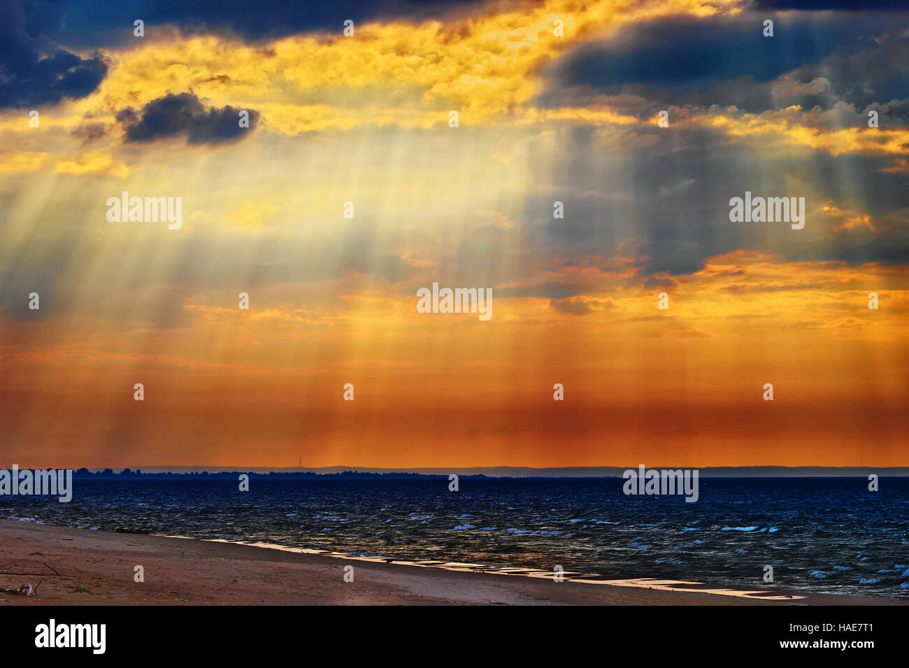 Cloudscape with crepuscular rays or sunbeams over the Baltic sea. Stegna, Pomerania, northern Poland. Stock Photo