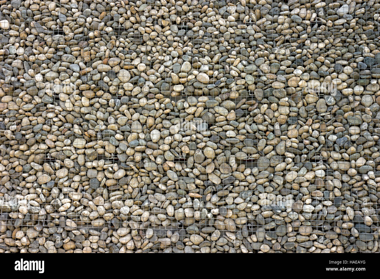 Backgrounds collection - The decorative stone wall built of sea pebbles Stock Photo
