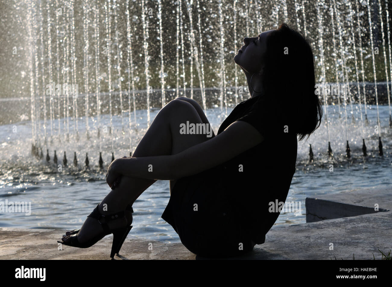Woman back view profile sitting hi-res stock photography and images - Alamy