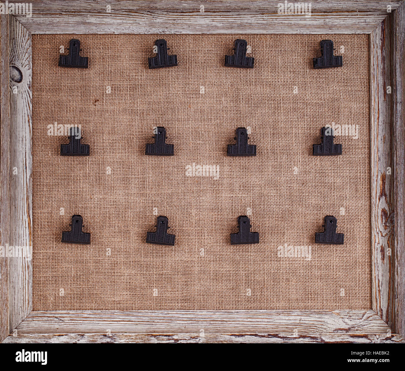 Notice board with hessian backing and twelve clips for holding notes,  framed in a distressed wood Stock Photo - Alamy
