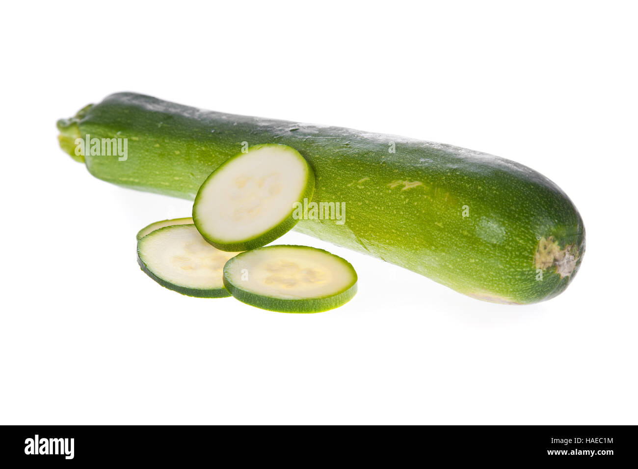 Sliced zucchini or courgette isolated on a white background. Stock Photo