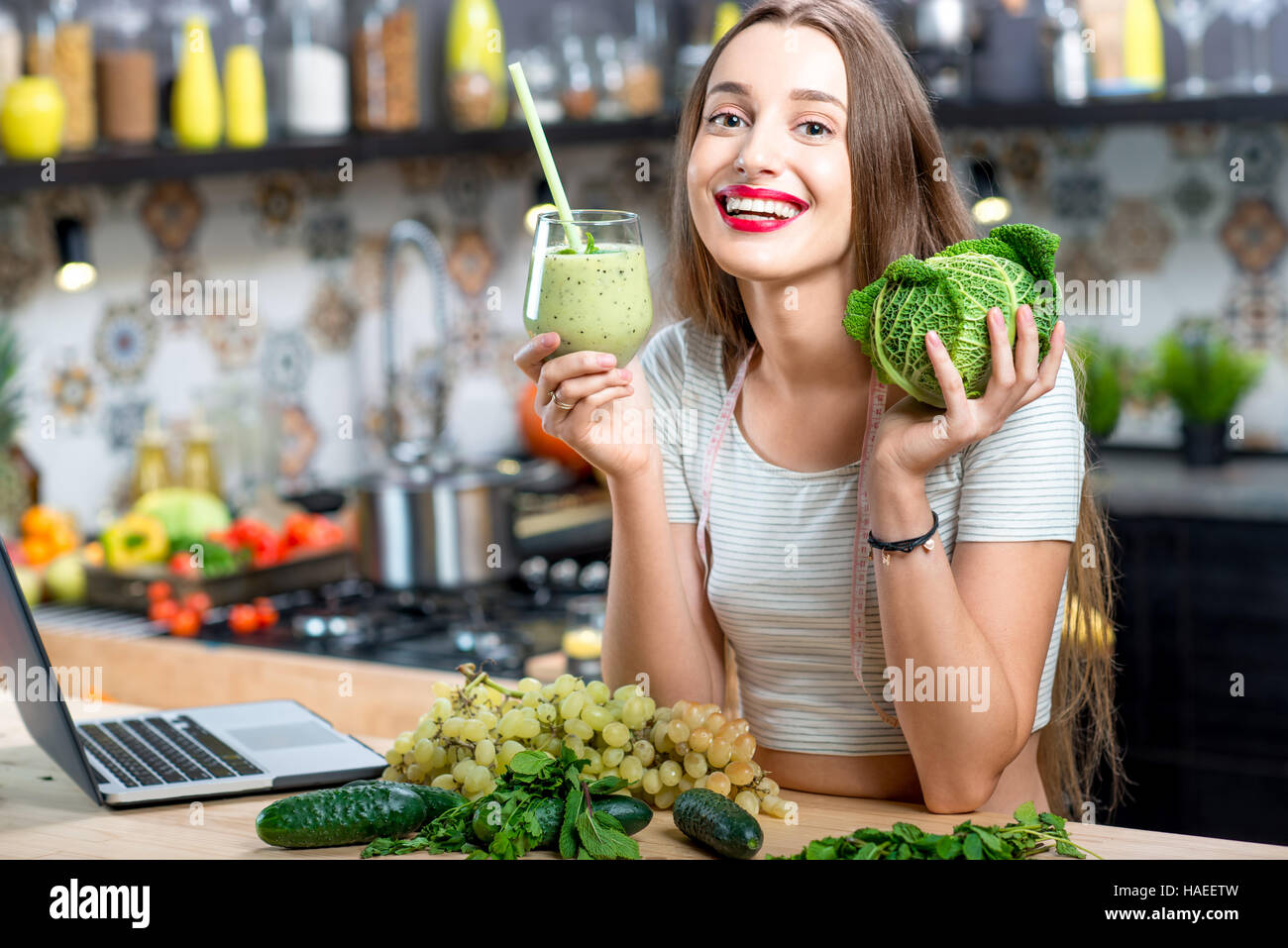 Woman with green smoothie Stock Photo