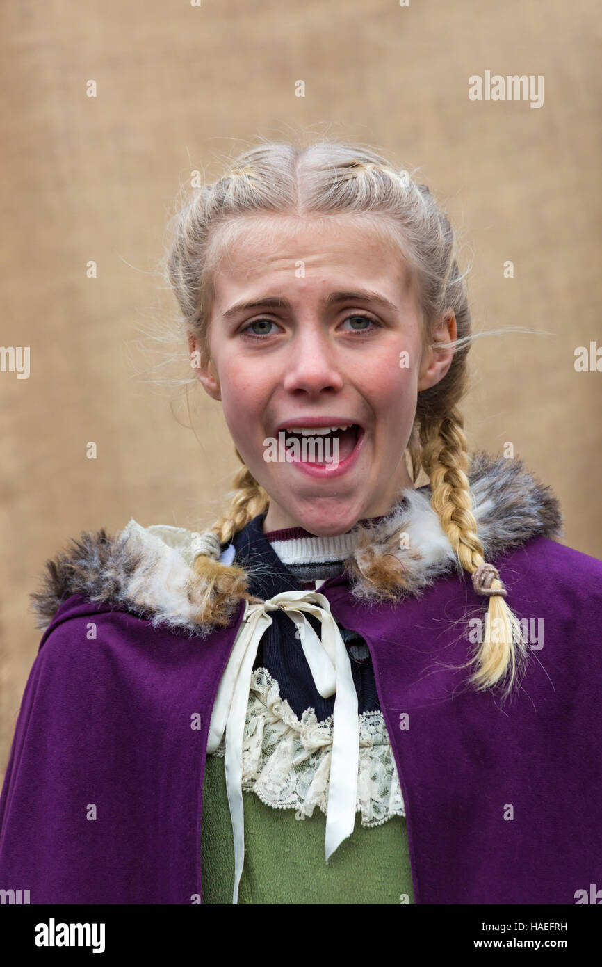 Girl singing at Victorian Festival of Christmas at Portsmouth, Hampshire, England UK in November Stock Photo