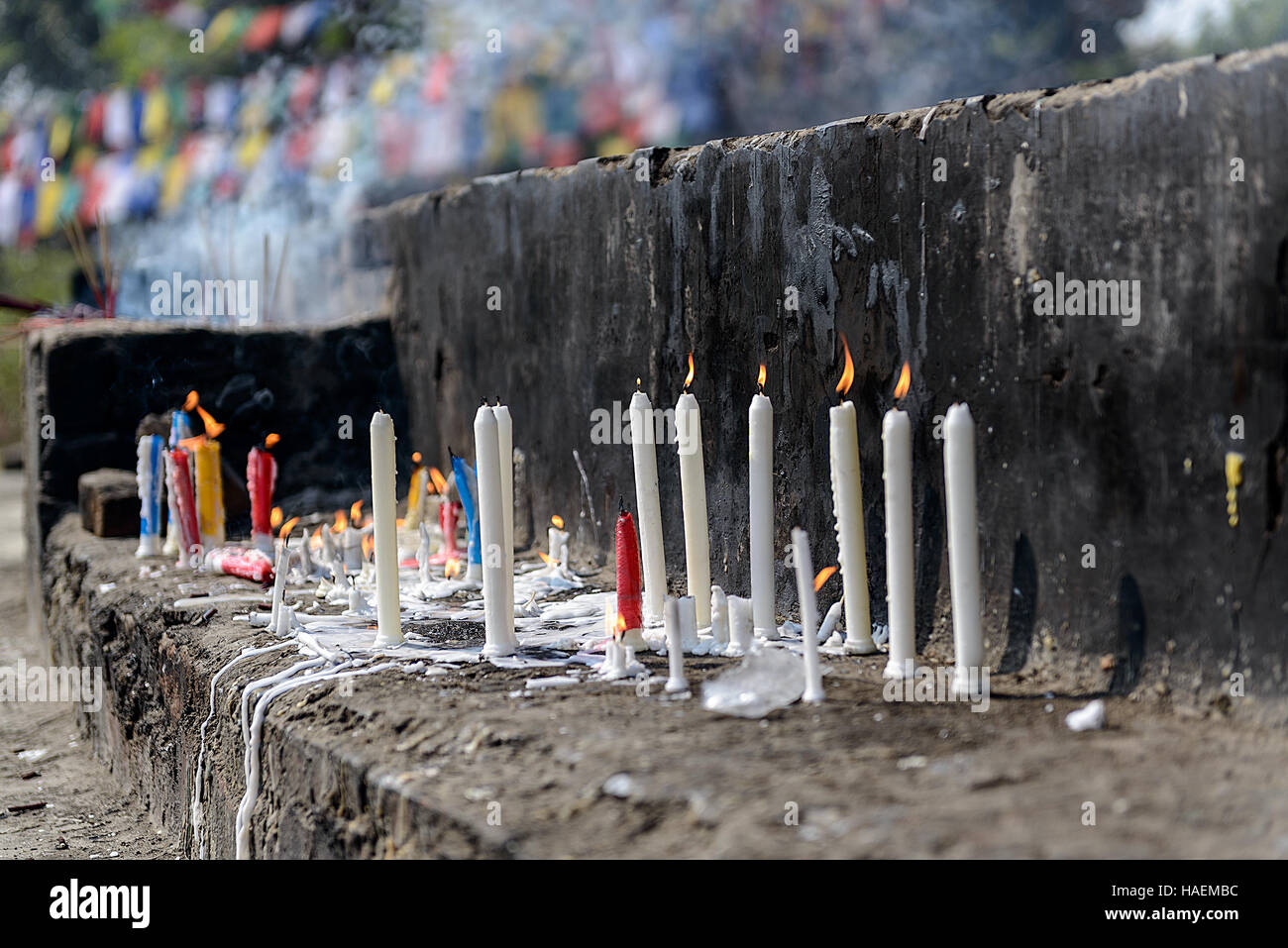 Burning and melting worship candles Stock Photo Alamy