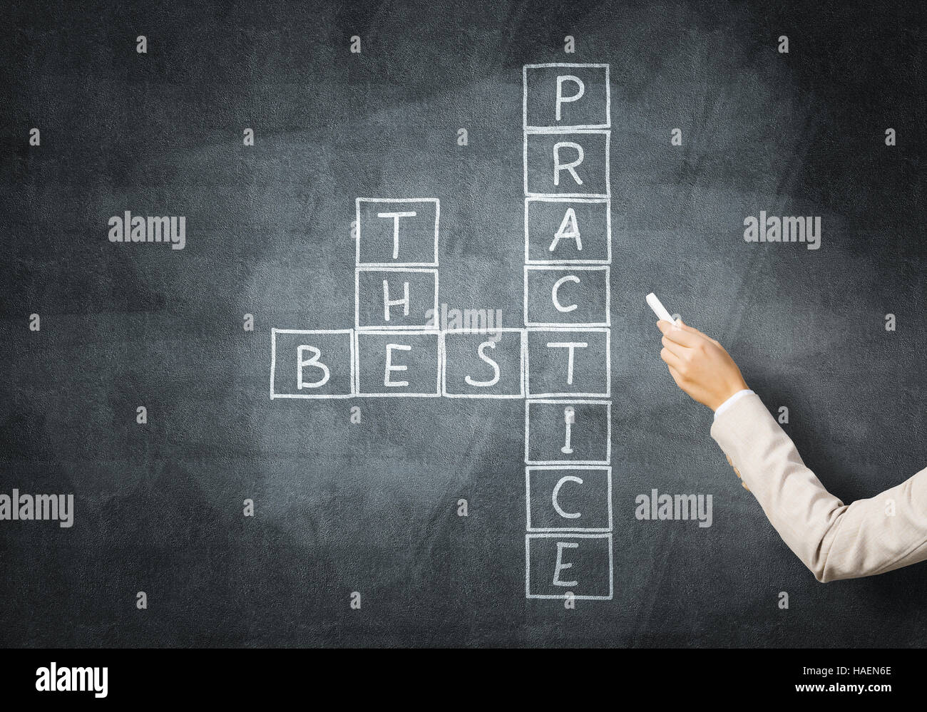 Woman draw crossword Stock Photo Alamy